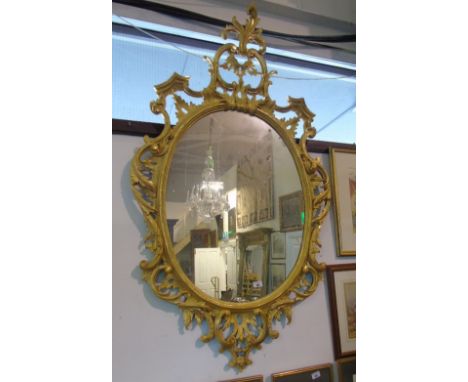 A Wonderful 20th Century Timber Gilt Oval Mirror, with very highly pierced carved surround.