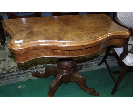 A Victorian Burr Walnut Card Table, standing on turned support and splayed legs joined by a central stretcher. 69cm h x 87cm 