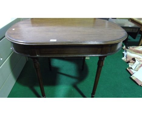 An Early Victorian Mahogany Oval Top Centre Table, standing on tapered ring turned supports.