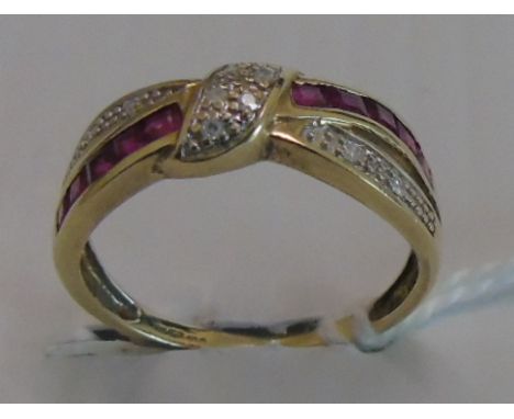 A Nine Carat Ruby and Diamond Cluster Ring. Size P.