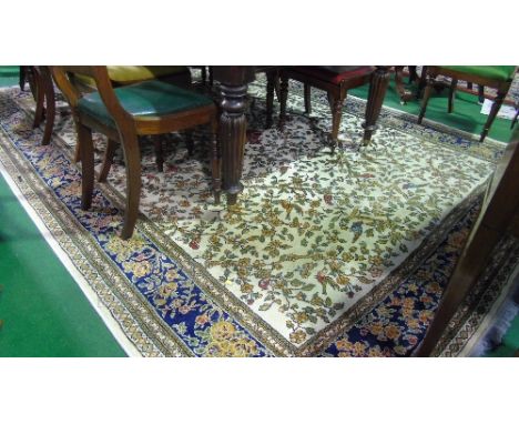 A Contemporary Persian Style Carpet, the white field with multiple floral detail and set within wide running borders, princip