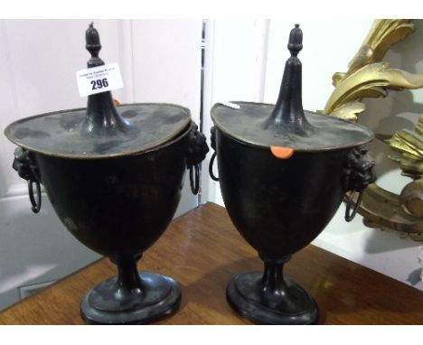 A Very Good Pair of 19th Century (Poss. Earlier) Cast Iron Urns with handpainted panels, lion mask ring handles and acorn top