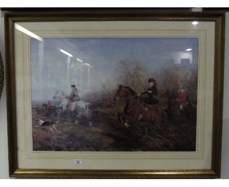 A Large Print of a Hunting Scene, mounted in a moulded and gilt frame.  32" x 22".