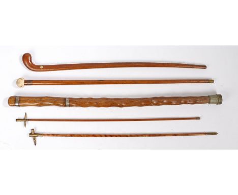 A collection of five Naval and Military related walking sticks to include, an oak walking stick with resin/composite ball han