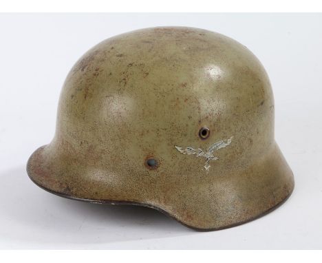 Second World War German M35 steel helmet by the maker F.W. Quist , Esslingen, makers initial and size 'Q66' stamped to inside