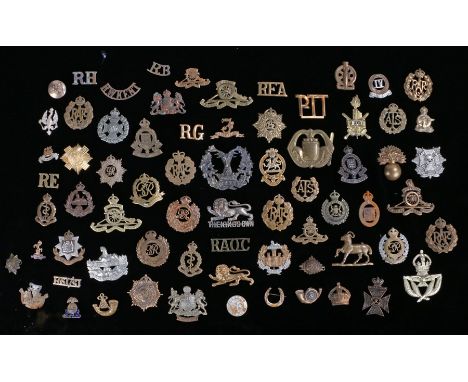 Collection of First and Second World War British army cap badges and shoulder titles, all with sliders and loops removed incl