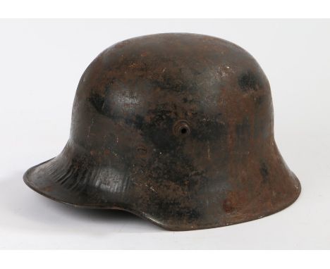 First World War German Model 1916 steel helmet by the maker F.C. Bellinger,Fulda, makers initials and size ' BF64 ' stamped t