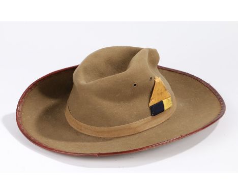 A Second World War British slouch hat, dated 1941 with insignia on right side believed to be for the Gold Coast, West African