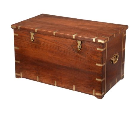 A TEAK AND BRASS BOUND TRUNK OR SILVER CHESTMID 19TH CENTURYOf campaign type, the lid enclosing a baize lined interior with r