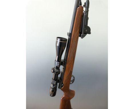 Anschutz Model 1415-1416 .22L bolt action rifle with sound moderator, bi-pod, Nikko Sterling 3-9x40 scope, chequered grip and