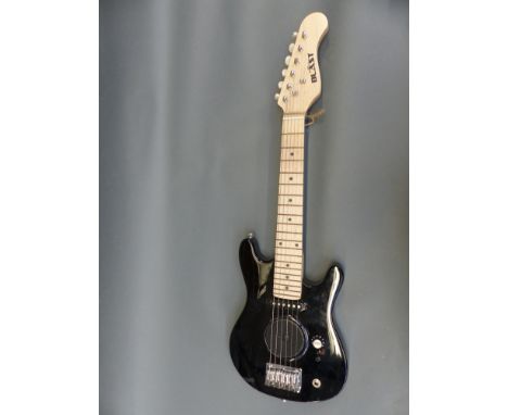 A child sized electric rhythm guitar by Blast with built in speaker, in black lacquered finish