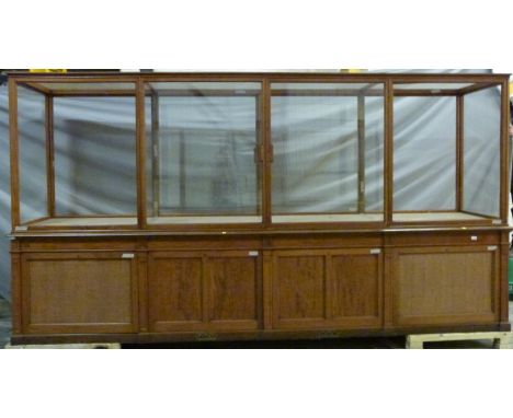Ex Victoria & Albert Museum early 20thC mahogany four bay glass display cabinet with glazed upper section and ceiling panels,