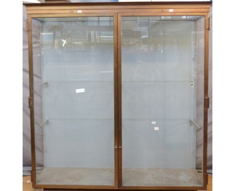 Ex Victoria & Albert Museum early 20thC two door glass display cabinet with bronzed frame, the letters K & L impressed to the