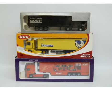 Three 1:50 scale diecast model lorries comprising Joal Renault Magnum with Komatsu Trailer, Lion Toys Leyland DAF 95XF and Te