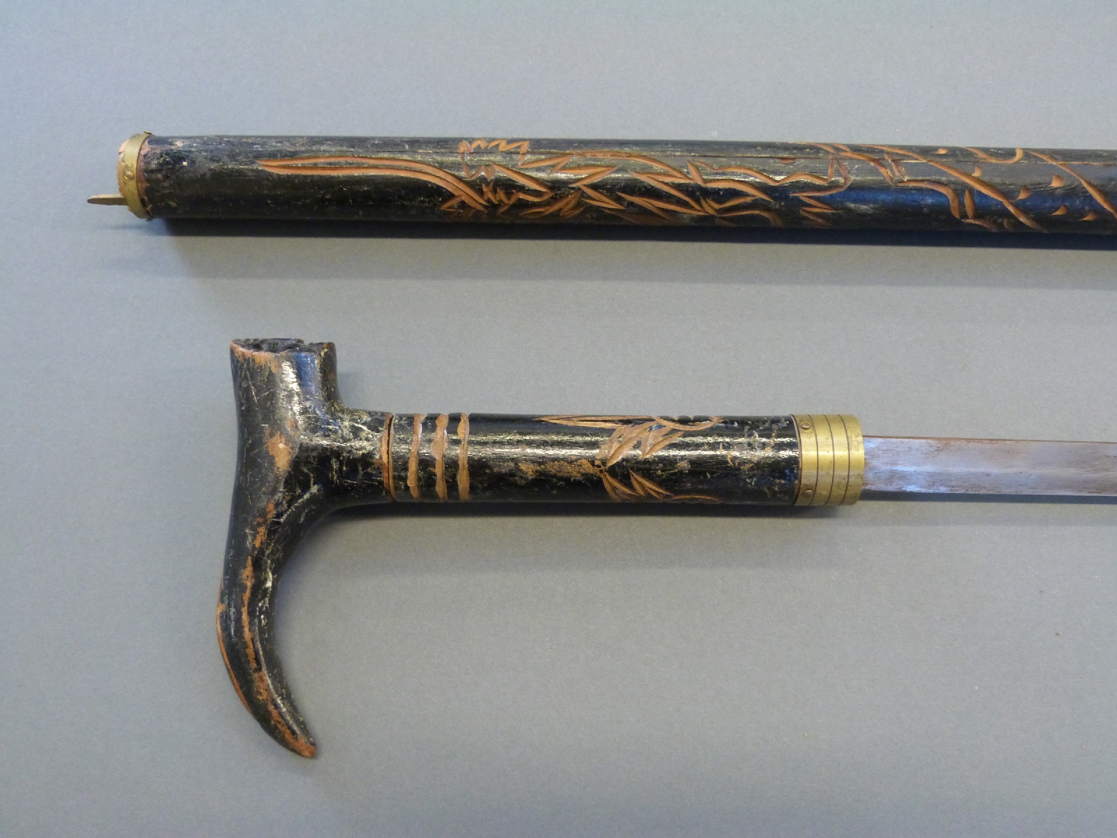 A sword stick with carved decoration, length of blade 46cm