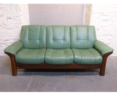 A Stressless three seater green leather sofa 