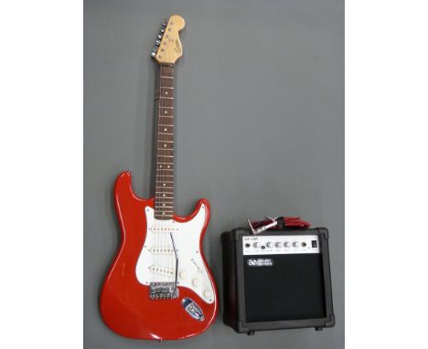 Encore electric rhythm guitar in red lacquered finish complete with an Acoustic Solutions GA-20W practise amplifier, soft cas