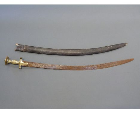 Indian Tulwar with brass handle and leather covered scabbard, blade length 74cm