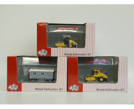 Three NZG 1:87 scale diecast model vehicles comprising two Bomag BW213 rollers 475 and 4752 and Bauwagen 560, all in original