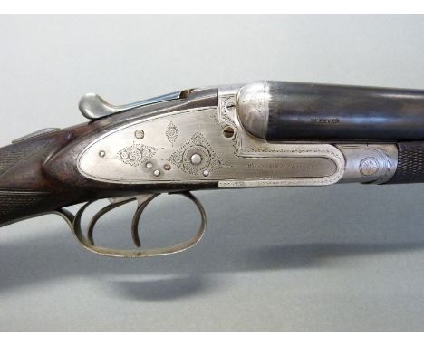 Williams & Powell 12 bore side lock shotgun with named and engraved locks, chequered grip and forend, engraved trigger guard,