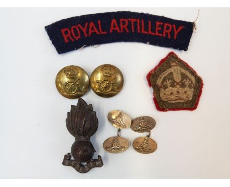 A collection of WWII related Royal Artillery ephemera to include a pair of white metal cufflinks, metal cap badge, buttons, c