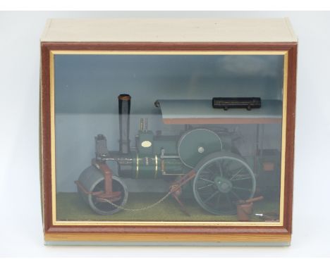 A scratch built model steam roller in wood and perspex display case, 26 x 23 x 13cm 