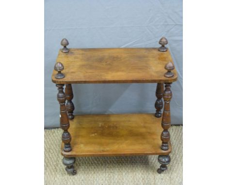 A 19thC two tier whatnot with turned supports raised on ceramic castors, W54 x D34 x H63cm 
