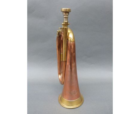 A military brass and copper bugle manufactured by Besson, London