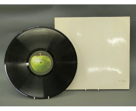 The Beatles White Album Stereo No 0527906 First Press, complete.  The vinyl and cover appear at least excellent condition apa