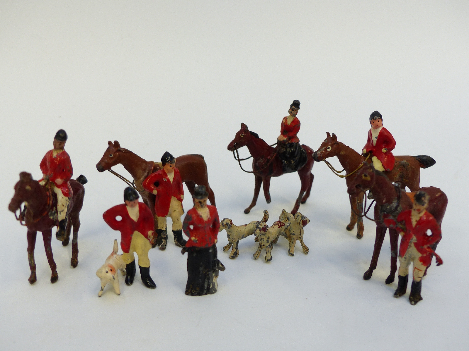 Fourteen lead hunting figures, horses and animals