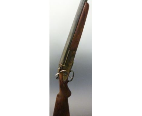 Unnamed 10 bore single barrelled hammer action shotgun with engraved lock, stylized dolphin hammer, trigger guard, top plate 