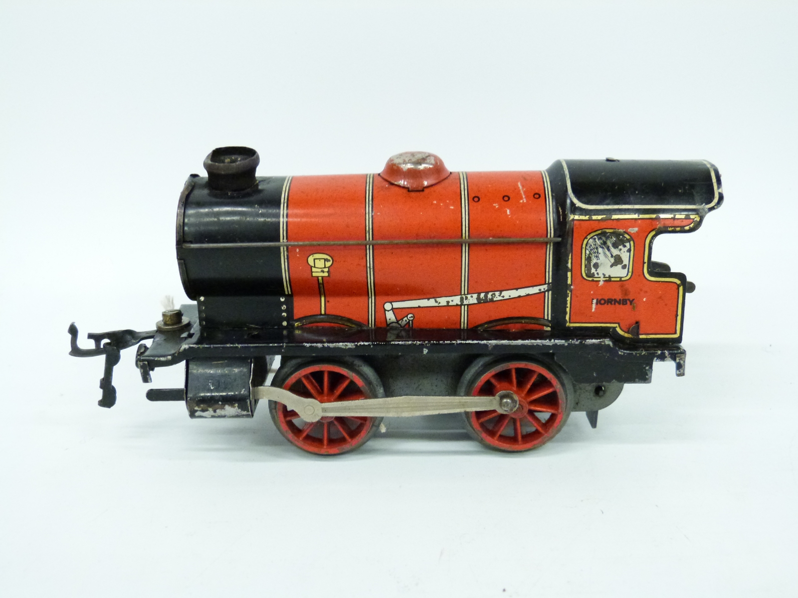 Hornby 0 gauge clockwork locomotive, four various coaches / wagons and ...