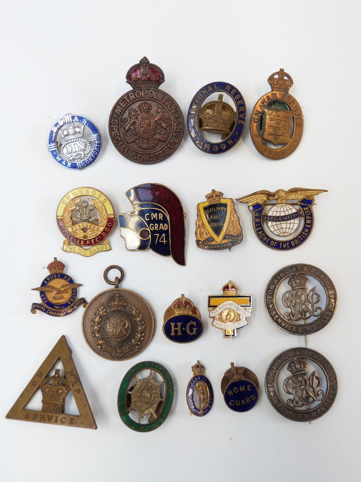 A collection of military enamel and other badges to include ...