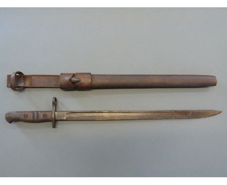 Remington WWI era bayonet stamped 1913 4 17 stamped to blade, with crown and arrow over 3A, blade length 43cm in leather scab