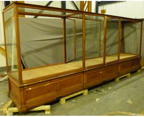 Ex Victoria & Albert Museum early 20thC mahogany four bay glass display cabinet with glazed upper section and ceiling panels,