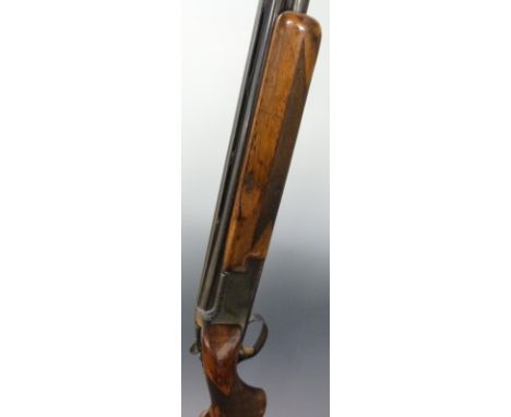 Browning 12 bore over and under ejector shotgun with engraved locks, top lever, underside and trigger guard, chequered semi-p