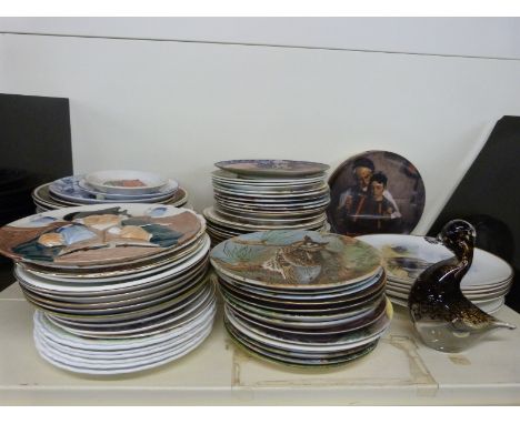 A large quantity of collectors plates including art subjects David Shepherd and Norman Rockwell as well as animals, floral an