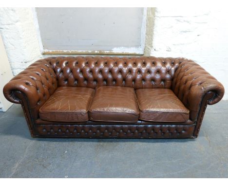 A Chesterfield brown leather two seater sofa 