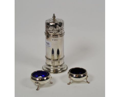 A Victorian silver caster and a pair of George III silver salt-cellars, the caster by Edward Barnard &amp; Sons Ltd, London, 