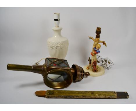 Hummel figural table lamp, Wedgwood Etruria creamware table lamp, brass carriage lamp and a razor strap