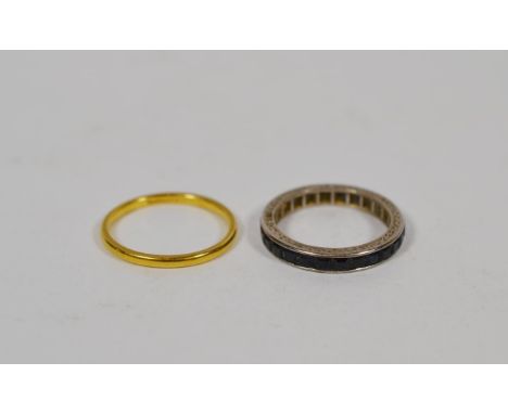 A band ring stamped 'Tiffany &amp; Co', finger size M; and a sapphire eternity ring, finger size L.  Band ring - other marks 