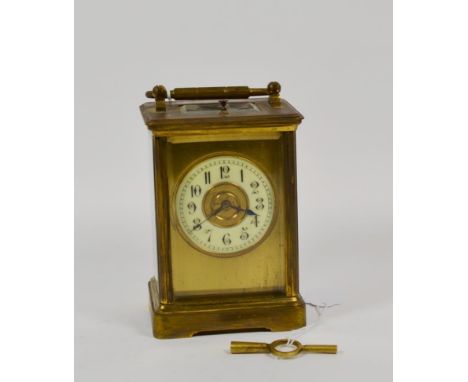 An early 20th century brass repeater carriage clock, white enamel Arabic chapter ring within gilt dial, 8 day striking moveme