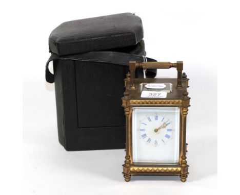 A late 19th/early 20th century brass carriage clock, white enamel dial with Roman &amp; Arabic numerals, 8 day striking movem