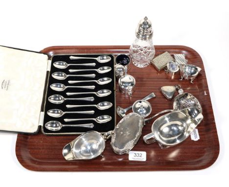 A group of silver including: a cased set twelve George V silver teaspoons, by Thomas Bradbury and Sons Ltd., Sheffield, 1933;