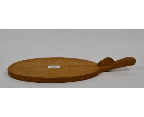 Mouseman: A Robert Thompson English oak cheeseboard, carved mouse signature, 39cm length