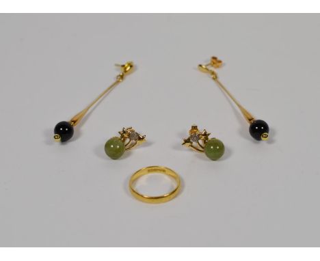 Two pairs of earrings stamped '375' and an 18 carat gold band ring, finger size N1/2.  Earrings - 7.07 grams. Band ring - 2.7