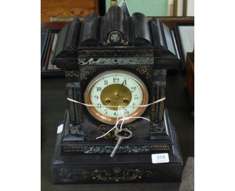 A Victorian black slate mantle clock
