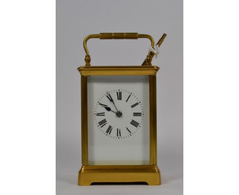 A large brass cased carriage clock, early 20th century, with key 