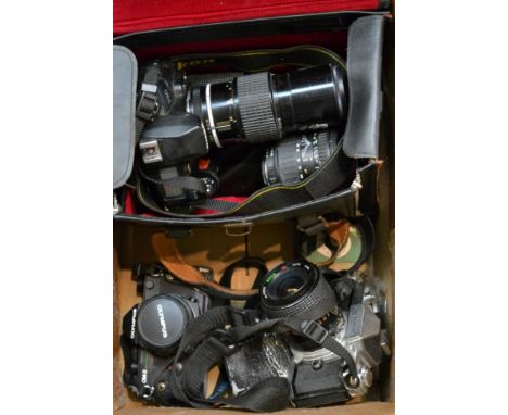 Collection of 35mm camera equipment, including two Nikon bodies and lenses