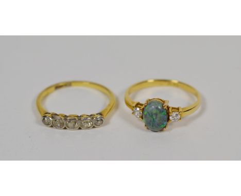 An old cut diamond five stone ring, stamped '18CT &amp; PT', finger size M1/2; and an opal and diamond three stone ring, stam